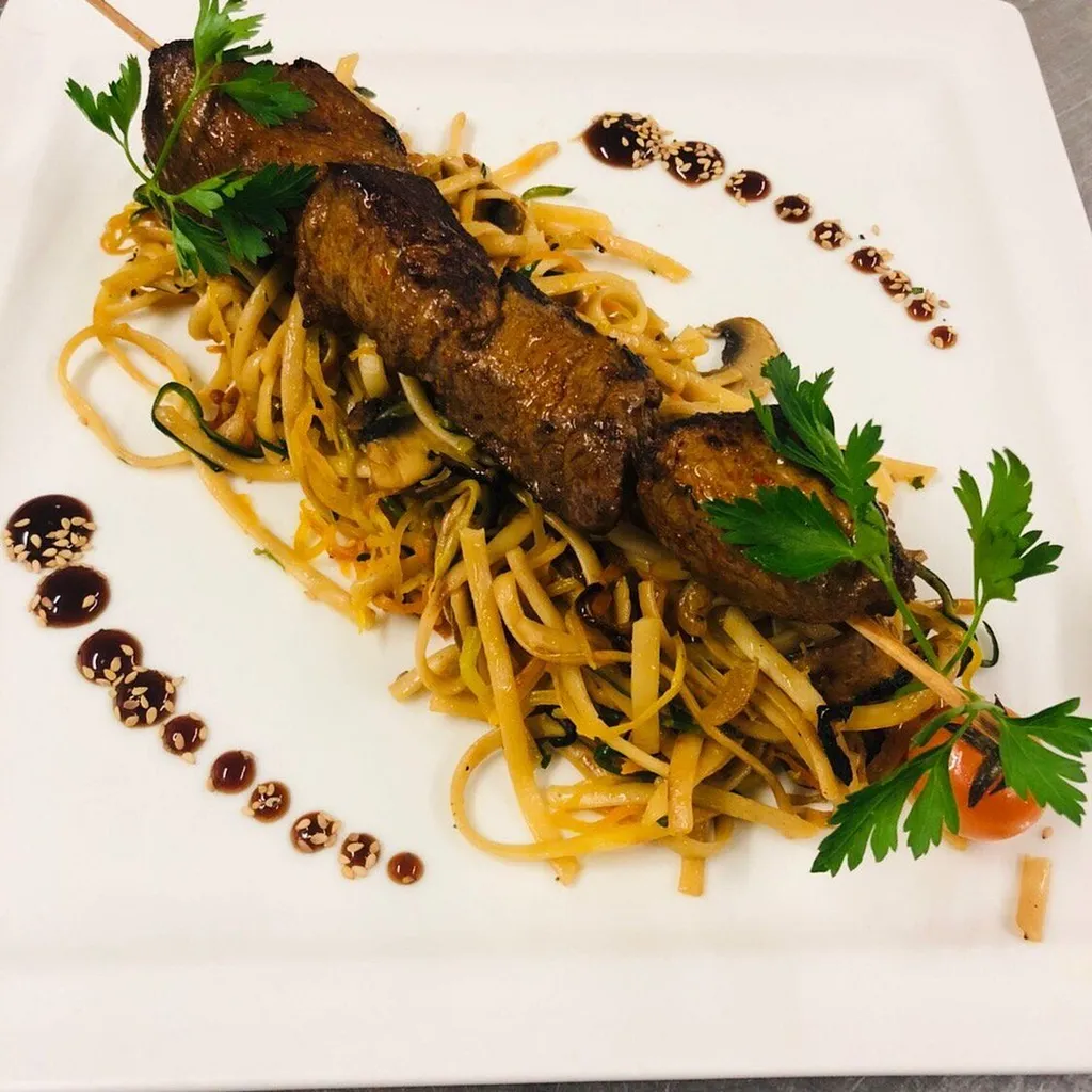 Une cuisine corse, un *feu de bois*, une table pour tous