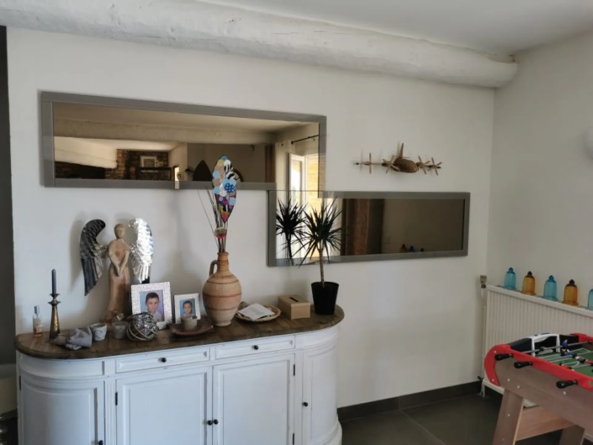 Miroir bronze et encadrement gris