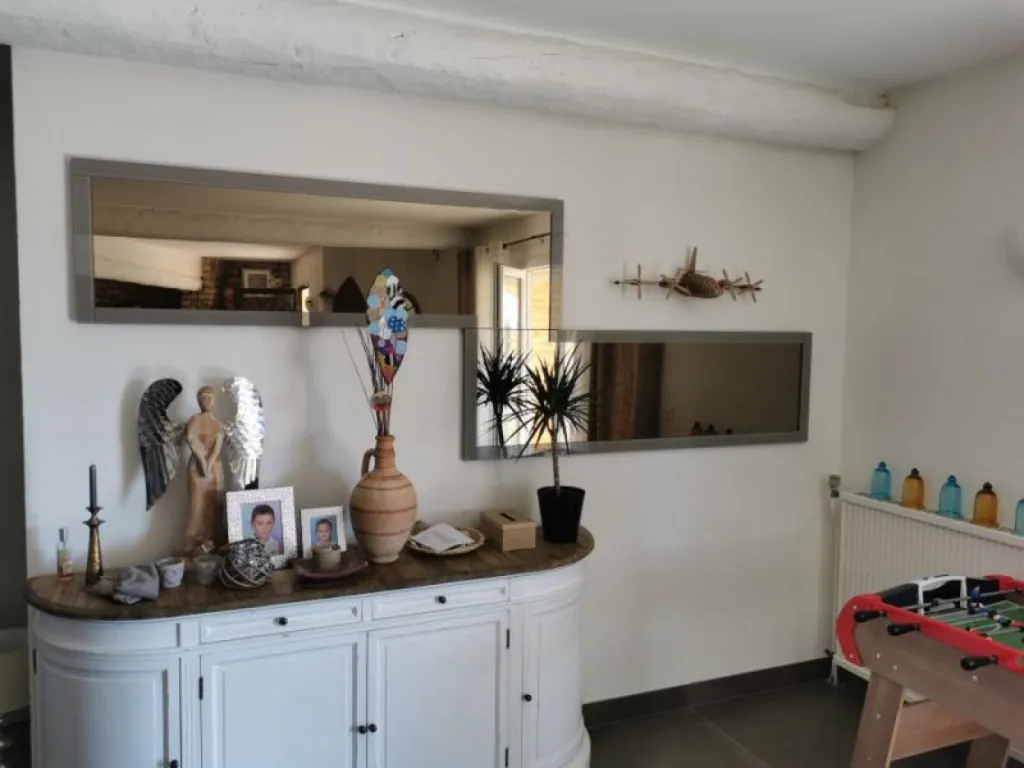 Miroir bronze et encadrement gris