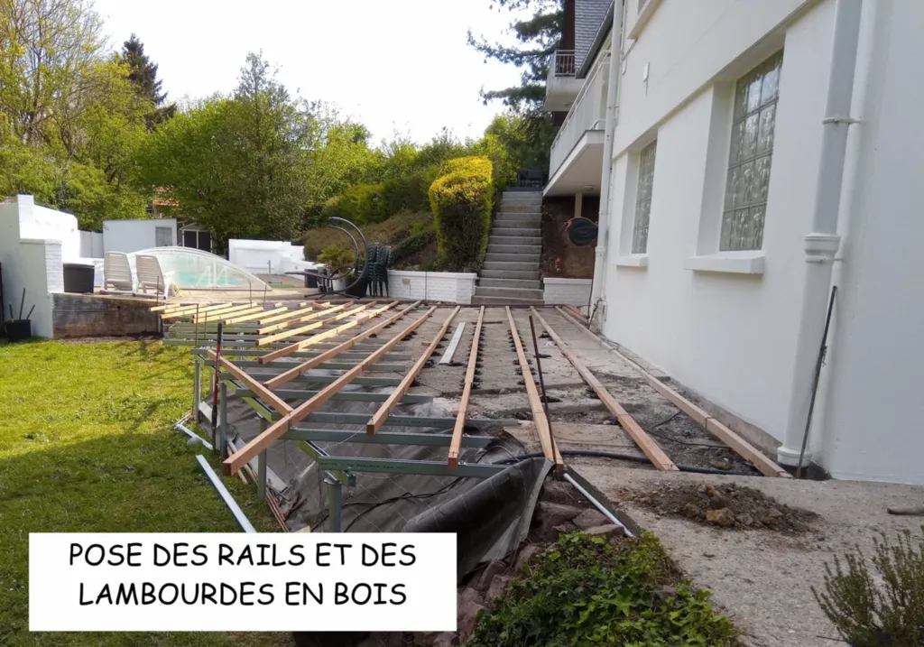 Pose des rails et des lambourdes en bois 