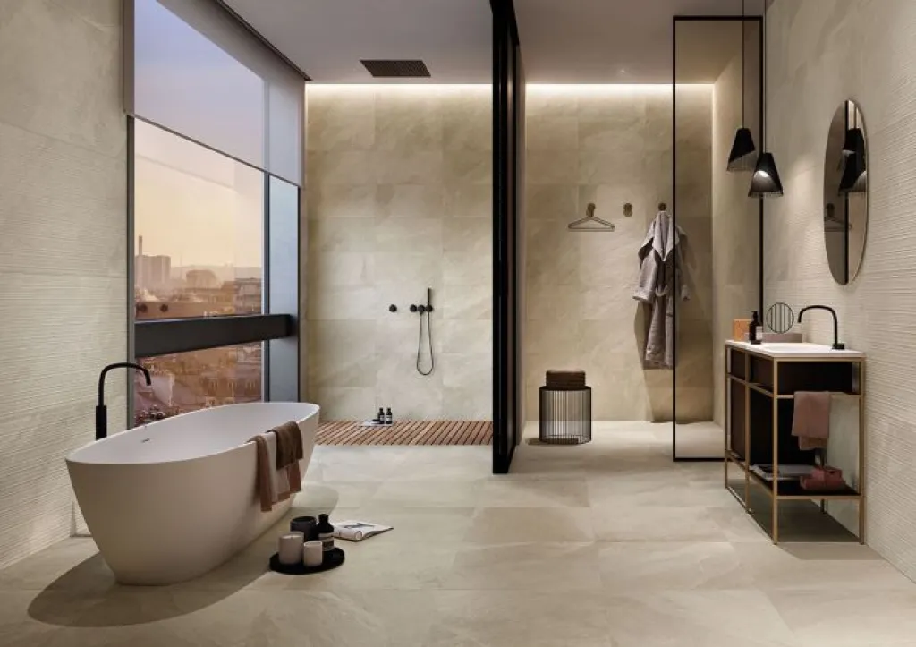 Rénovation entière d'une salle de bain avec du carrelage de sol et mur aspect pierre naturelle à Isneauville proche de Rouen 76.
