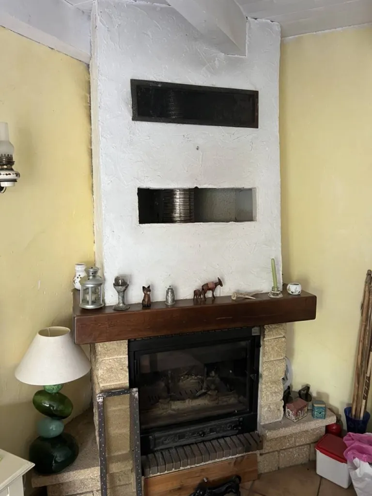 Suppression d'une cheminée à bois et pose d'un poêle à bois moderne sur Sablons 38 Isère