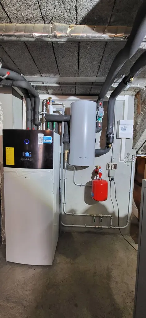 Installation d'une pompe à chaleur Daikin d'une puissance de 14 KW à Péron proche Saint-Genis-Pouilly