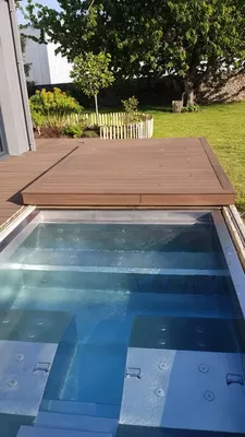 Création et pose d'un spa inox de 2x3m avec 4-5 places avec terrasse coulissante pour une protection et fermeture solide à Pléneuf Val André en Bretagne