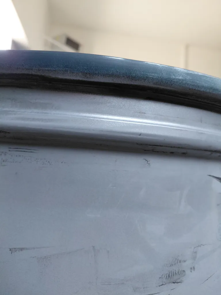 Réparation jante Tesla avec Ajout de matière Aluminium sur Limonest