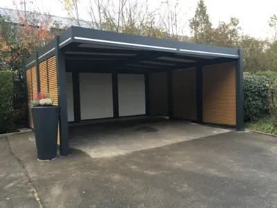Réalisation d'un carport en aluminium pour deux voitures de 6m x 5.50m en teinte gris 7016 à Montbéliard