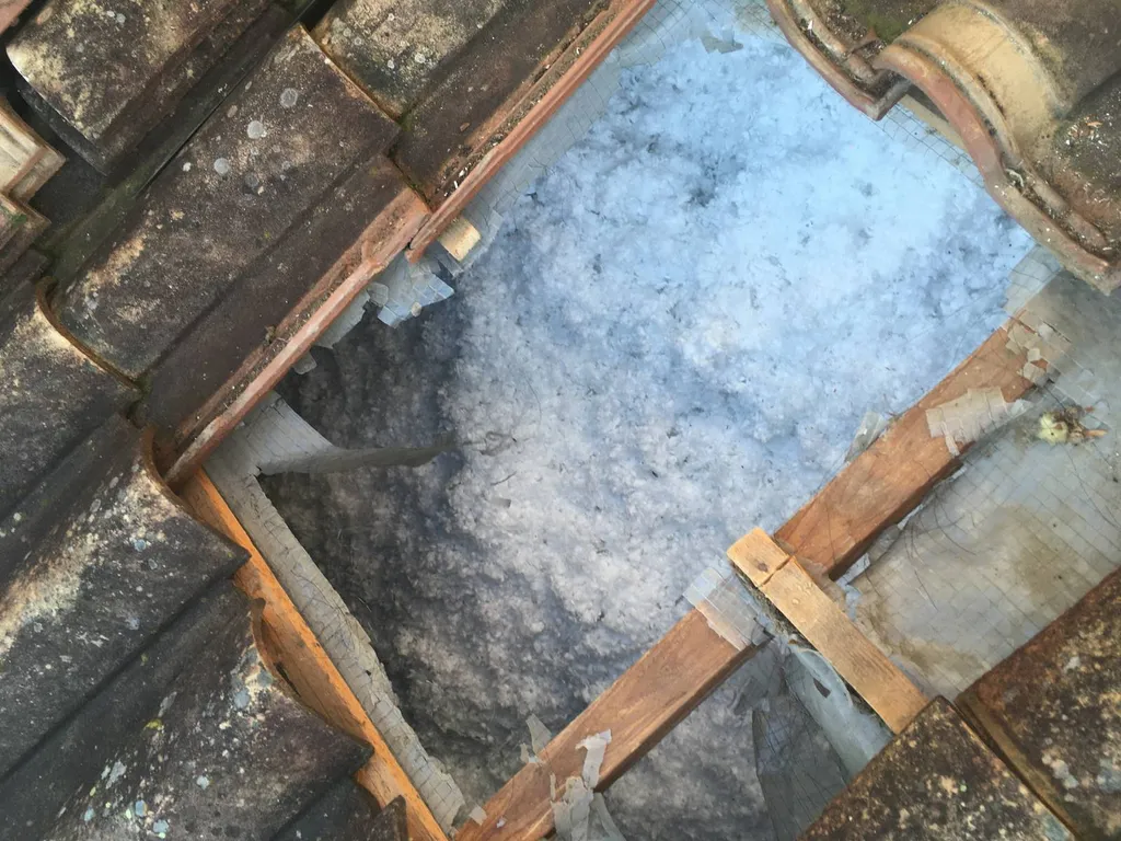 Isolation énergétique des combles perdus par soufflage de laine de verre à St Germain au Mont d'Or