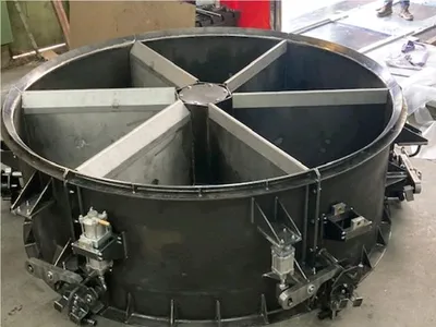 Fabrication sur mesure d'une enfourneuse industrielle pour Lafarge Cruas par GIRARD FRERES, expert en chaudronnerie lourde et maintenance mécanique