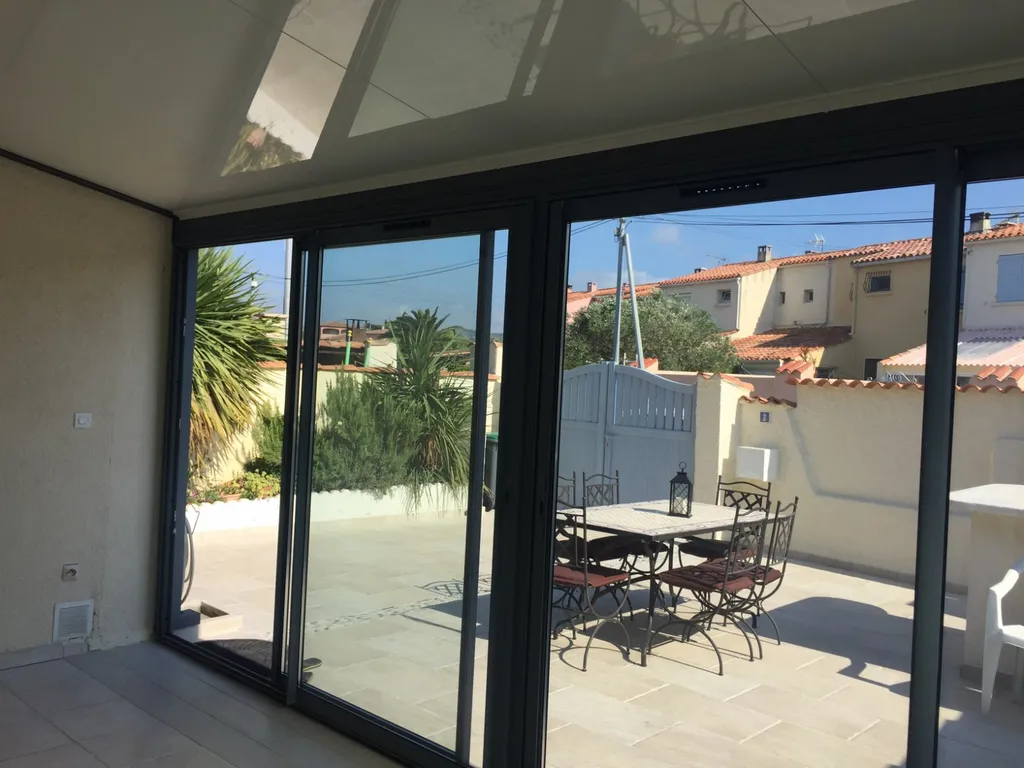 Véranda avec porte coulissante sur Châteauneuf-les-Martigues