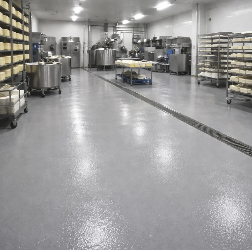 Mise en œuvre de polyuréthane ciment SIKACRETE dans une fromagerie professionnelle située à Paris proche du 11ᵉ arrondissement