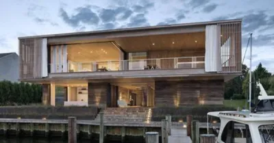 VILLA RENOVEE ET EXTENSION EN STUC TERRE DU MONDE DANS LES HAMPTONS ETATS UNIS