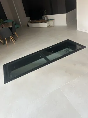 Réalsation d'une trappe de sol pour une cave, en acier , vitrée avec vérins électriques 