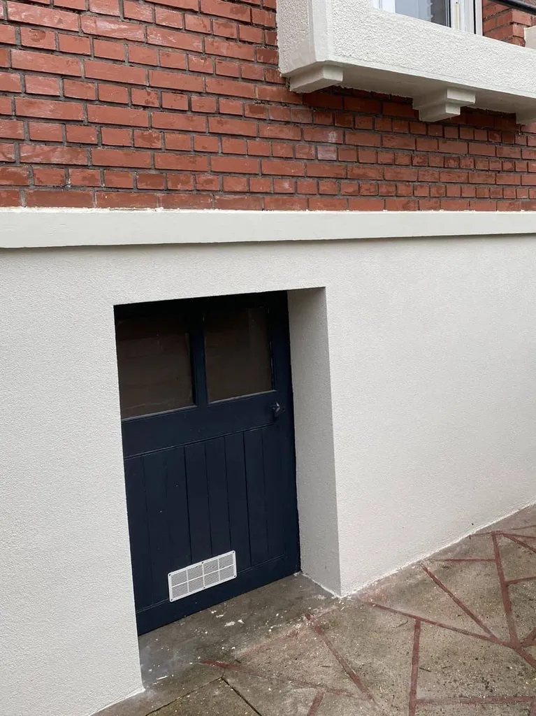 Ravalement et isolation thermique par l’extérieur réalisés sur une façade de maison au Havre.