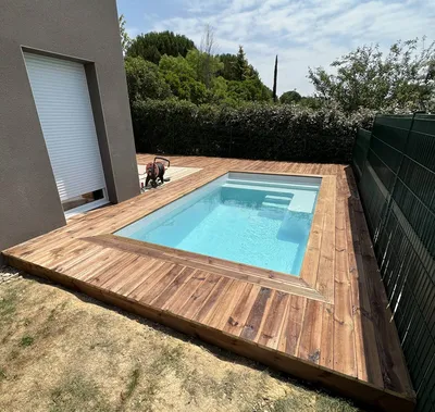 EXTENSION D'UNE TERRASSE BOIS EN PIN SUR DE LA TERRE DANS LA COMMUNE D'AIGREFEUILLE
