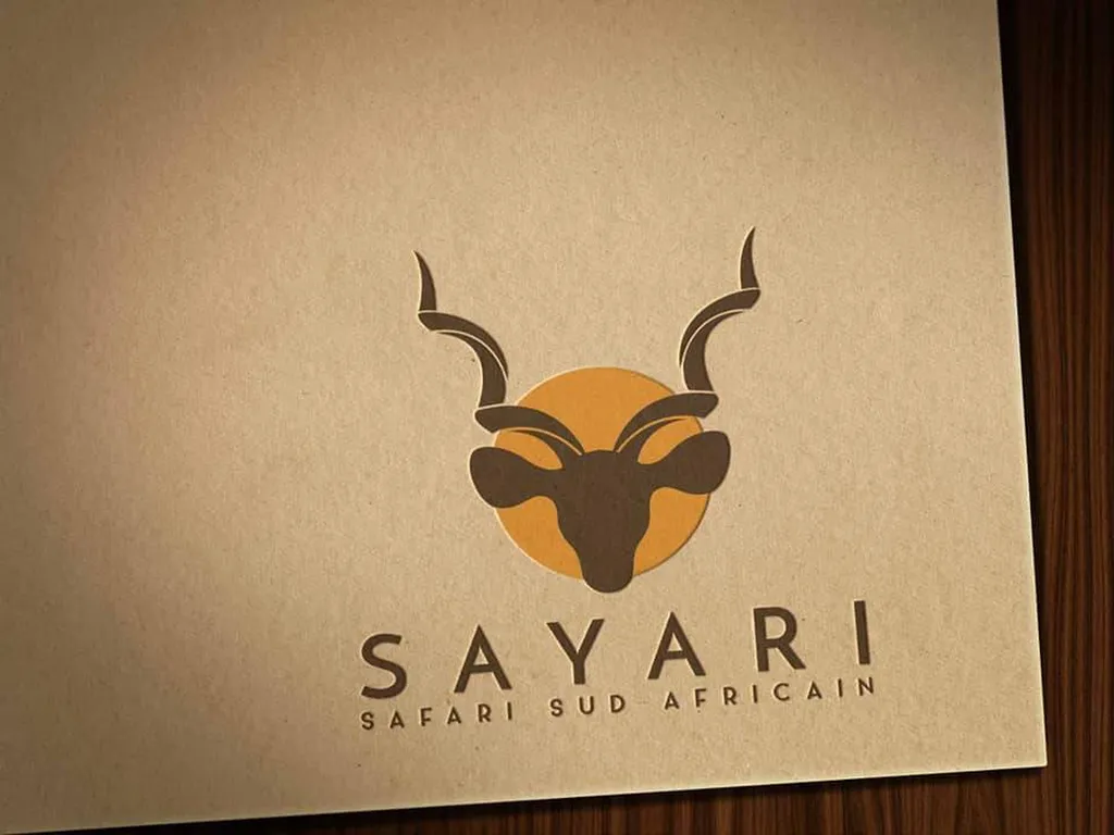 graphiste création de logo pour agence de voyage et impression sur papier cartonné kraft
