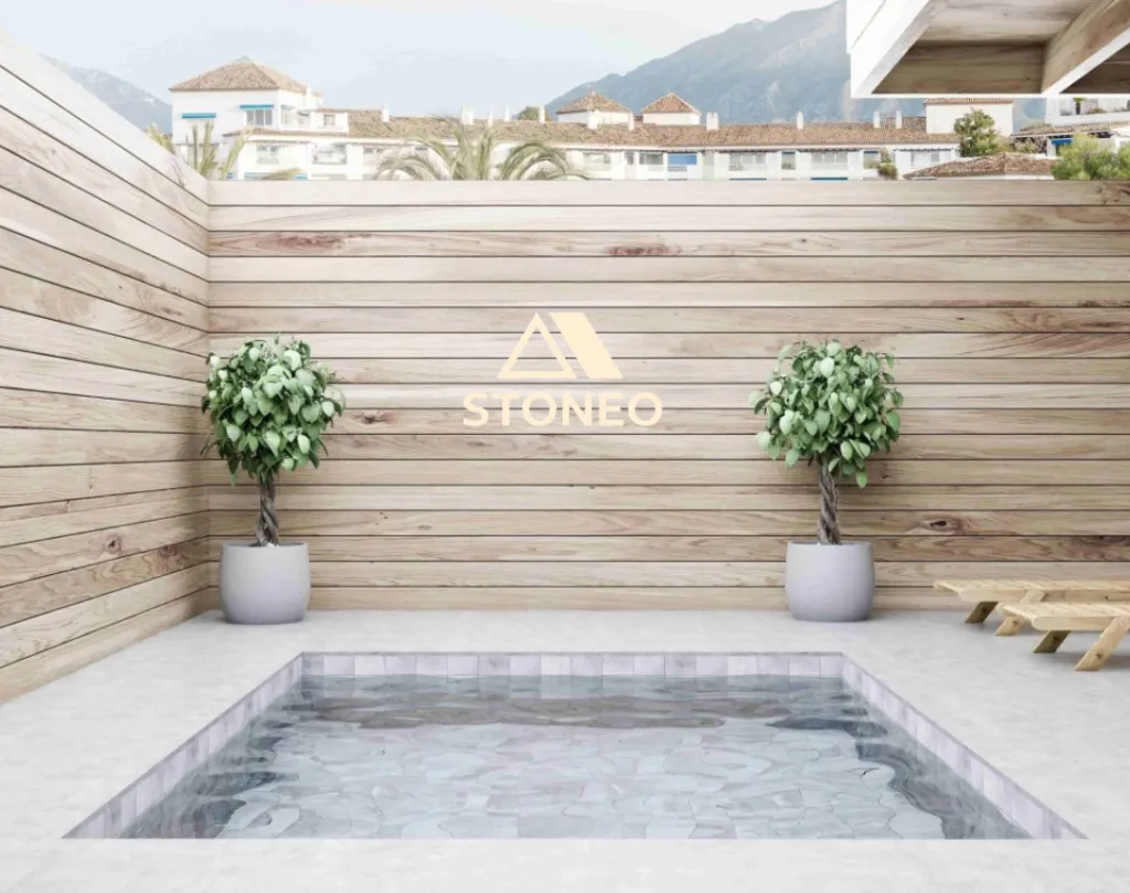 Habiller les abords de sa mini-piscine avec de la moquette de pierre. STONEO votre spécialiste 26, 38 et 07 en granulat de marbre et résine vous conseille à Saint-Rambert-d’Albon, Salaise-sur-Sanne, Chanas et partout dans le 26, 07 et 38