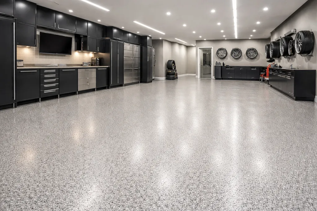 Pose de résine époxy quartz Color pour garage premium avec finition décorative située à Paris proche du 17ᵉ arrondissement