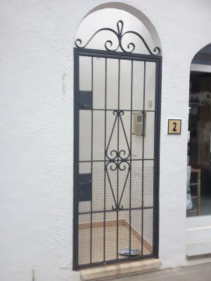 PORTE EN FER FORGE VOLUTES CARRY LE ROUET