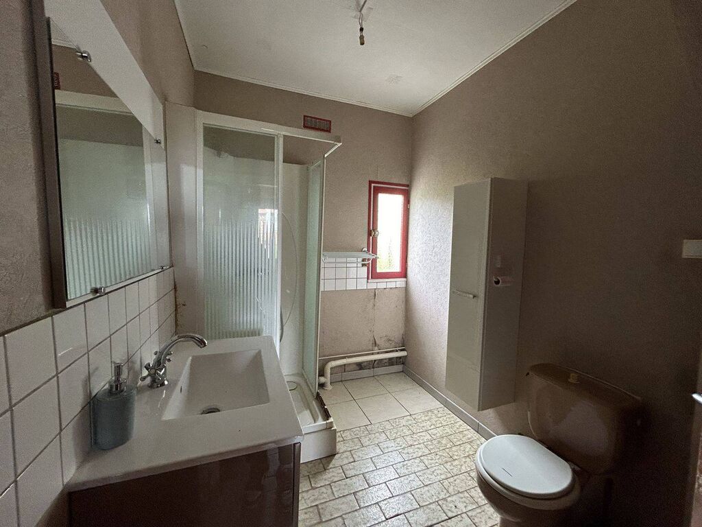 Maison de ville avec potentiel – À 5 minutes de Dieppe, jardin et garage inclus