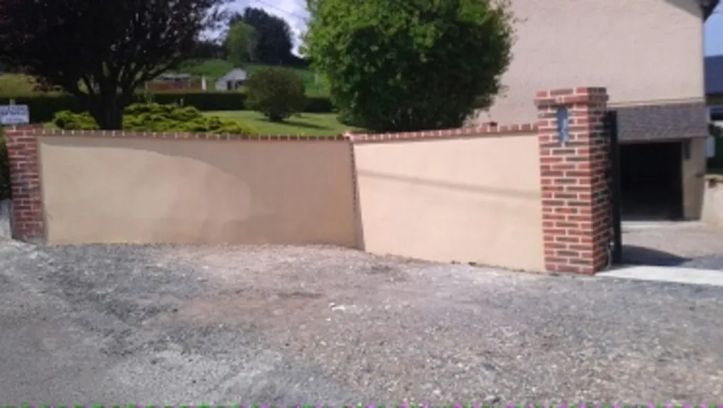 Réalisation d'enduit ton pierre sur mur à Pont Audemer 27