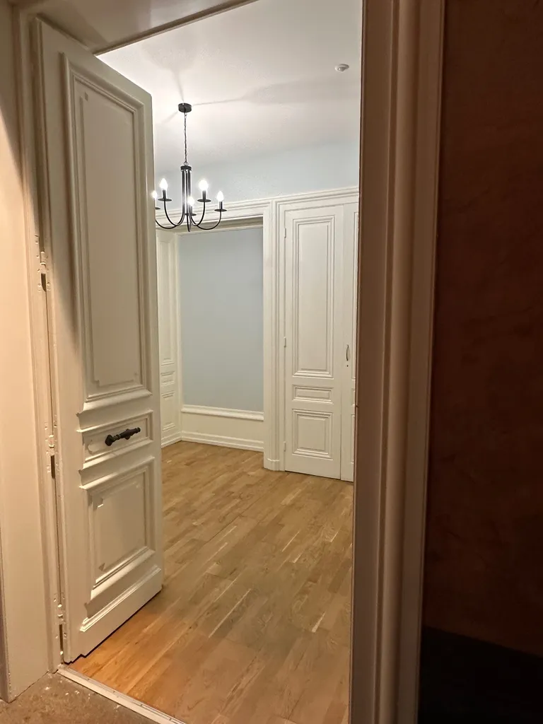 T3 duplex de caractère avec poutres apparentes aux portes de Lyon