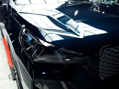 Détail du film de protection PPF sur pare-chocs BMW iX1
