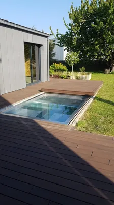 Création et pose d'un spa inox de 2x3m avec 4-5 places avec terrasse coulissante pour une protection et fermeture solide à Pléneuf Val André en Bretagne