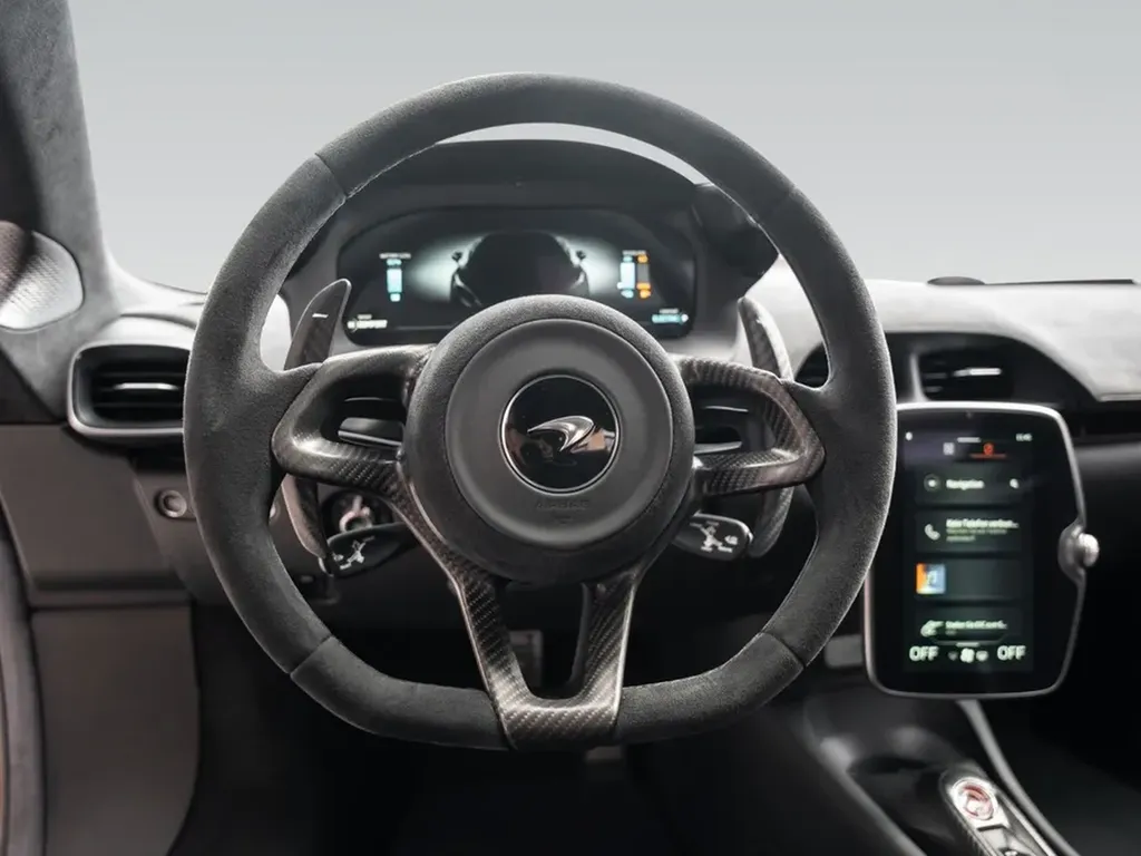 McLaren Artura poste de conduite volant carbone Alcantara Bordeaux