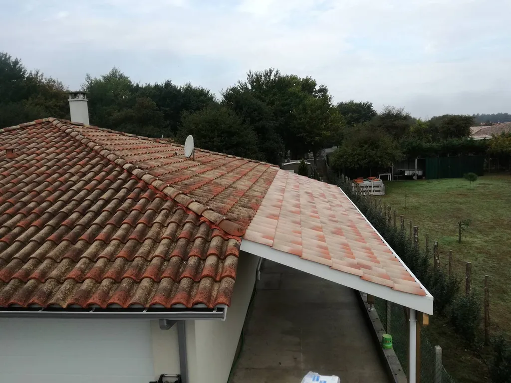 Construction d'un carport de 11 mètres de long dans le prolongement de la construction existante
