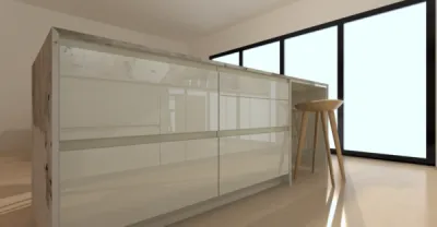 Cuisine avec ilôt central de préparation, rangements et coin repas