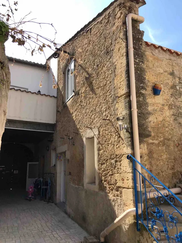 Rénovation mur en pierre sur une maison de village à Boujan-sur-Libron proche de Béziers