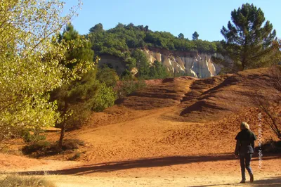 Explore the contrasting beauty of Rustrel, where peaceful village life meets the spectacular red cliffs and ochre trails of the Provençal Colorado