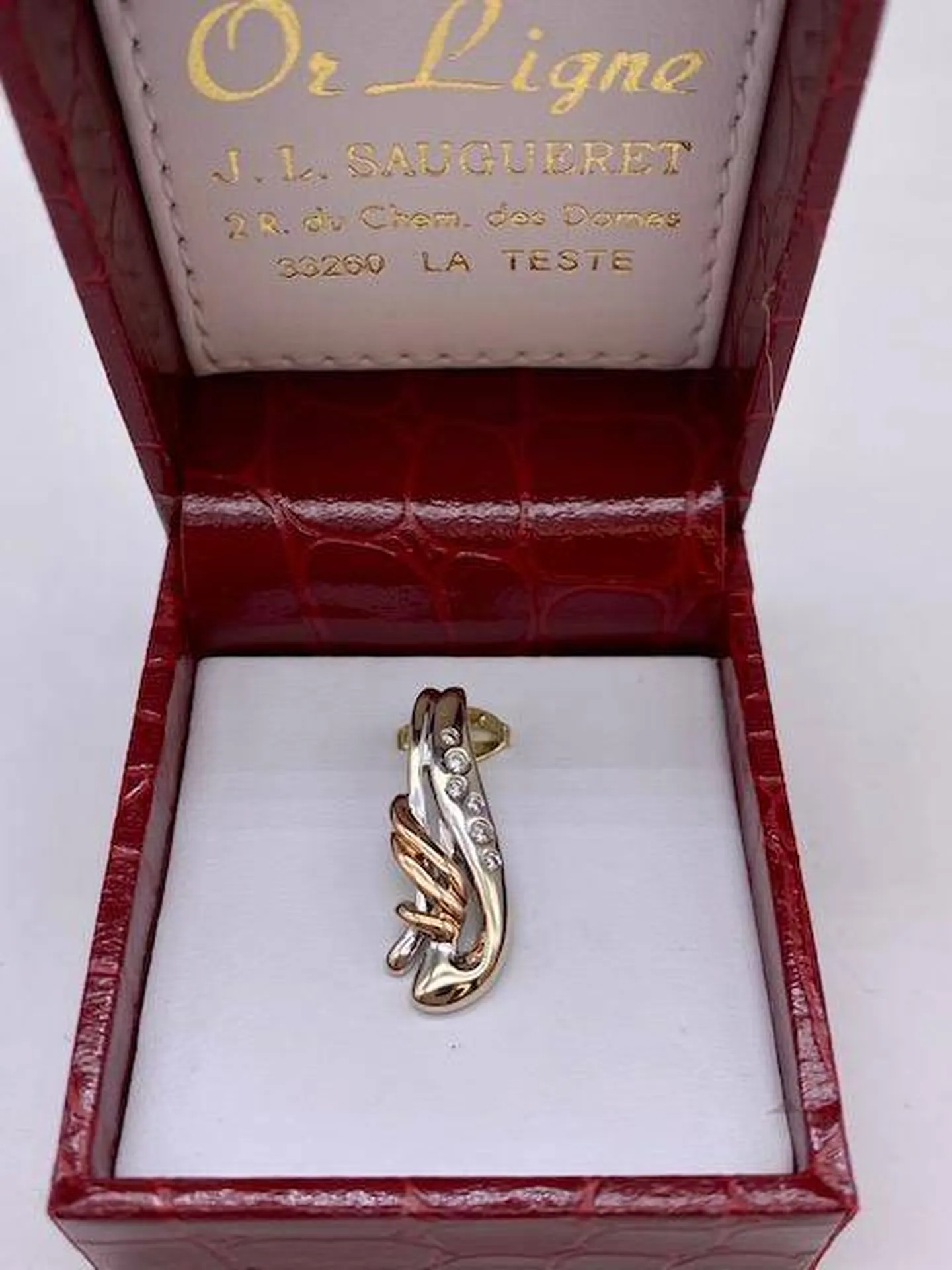 Pendentif vague en or gris et rose 750/1000ème et diamants en dépôt vente chez Or Ligne à La Teste sur le Bassin d'Arcachon