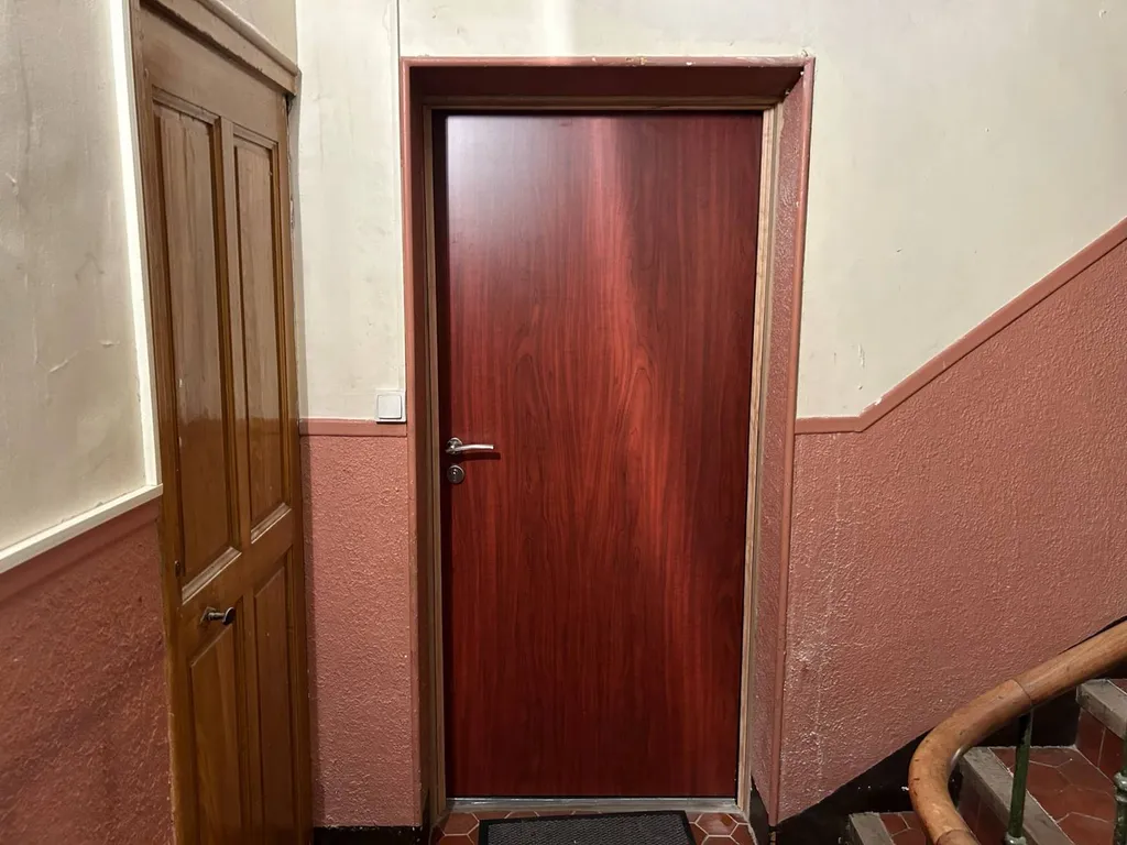 Réalisation d'une porte palière dans un immeuble sur Apt