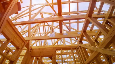 Extension ossature bois pour maison familiale à Pessac : ajouter une pièce de vie lumineuse avec toit terrasse végétalisé