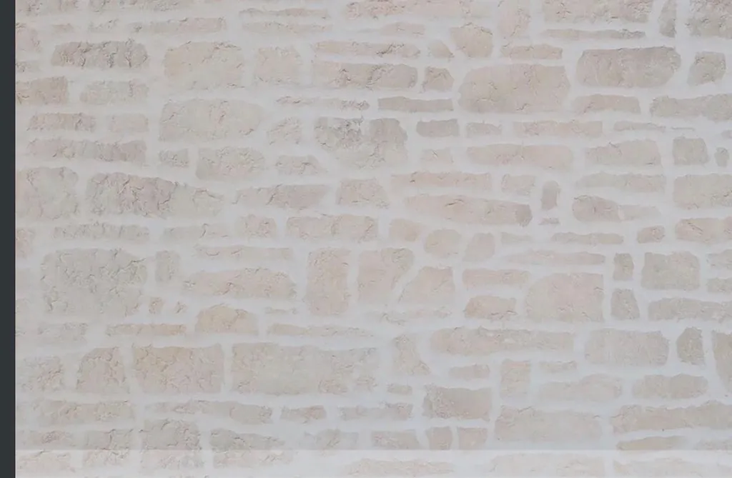 Artisan pour une maison enduit projeté effet pierre proche du Havre