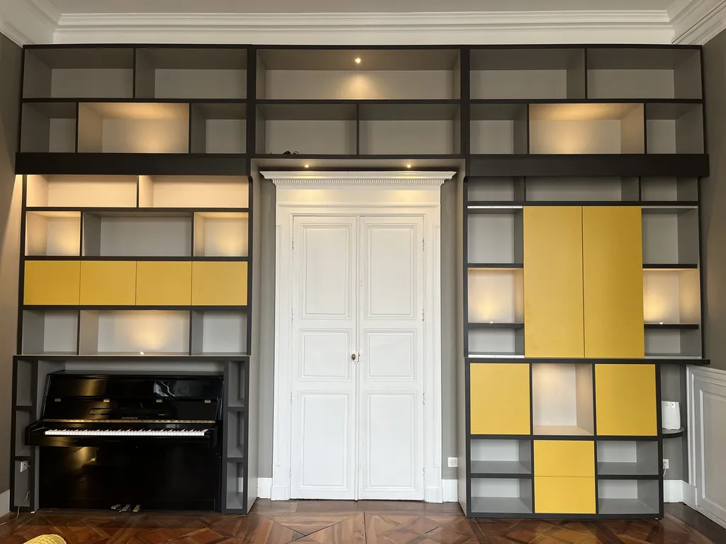 Bibliothèque sur mesure : fabrication artisanale et pose de rangements bois pour salon, bureau et pièces de vie par un menuisier expert en agencement intérieur à TOULOUSE