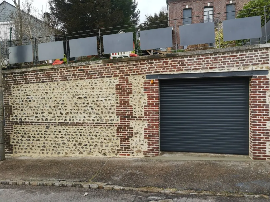 Rénovation d'un mur extérieur en silex et brique sur Rouen 76