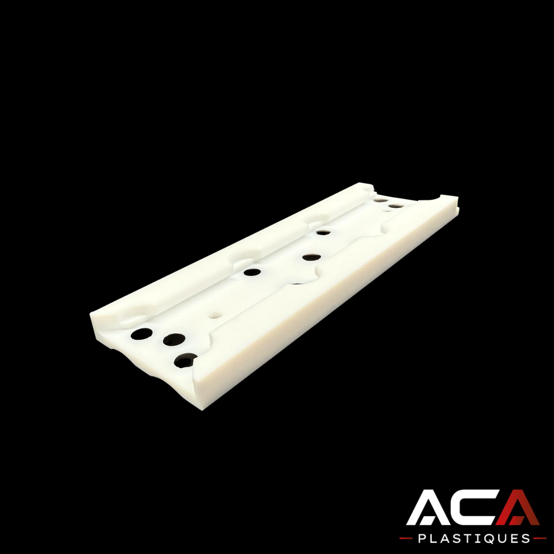 usinage cnc de précision d'un gabarit industriel en ptfe blanc de 25 mm avec rainures et perçages par aca industries à signes
