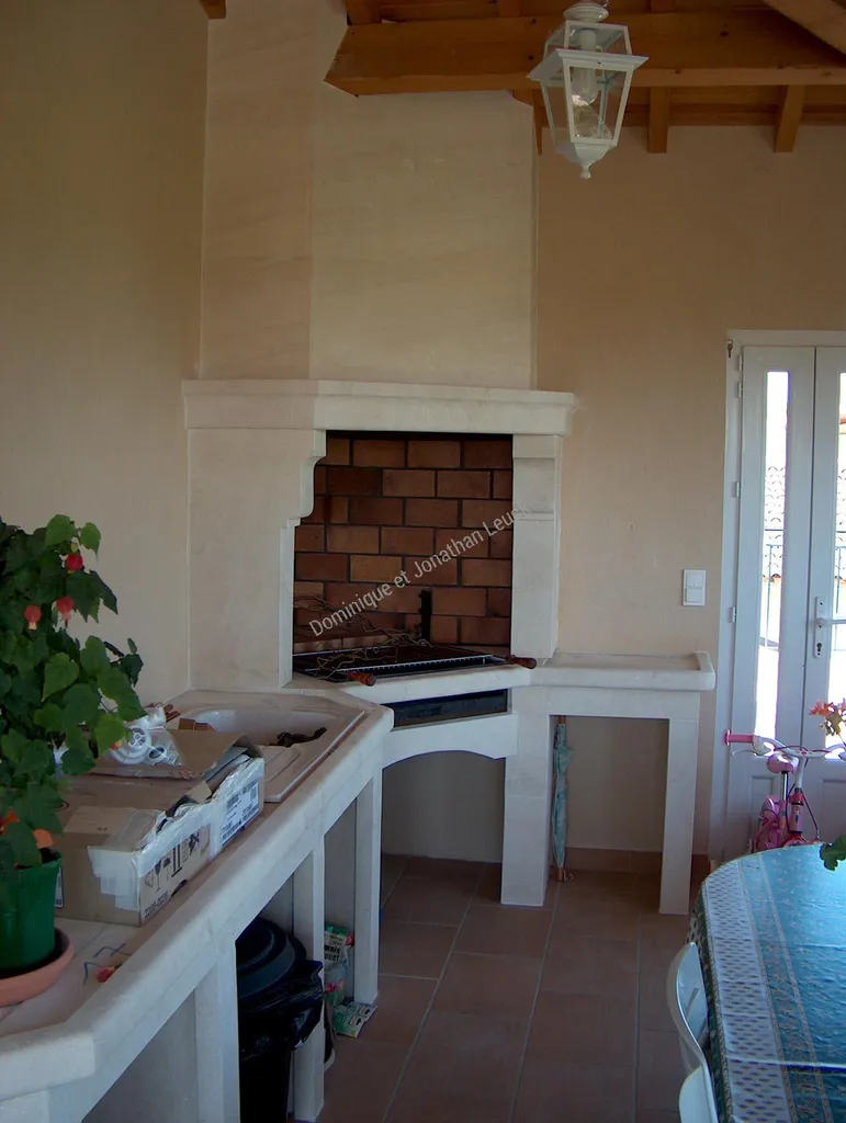 Aménagement cuisine d'été en pierre et granit