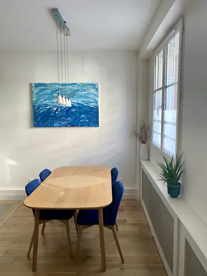 Table salle à manger vaste séjour avec cuisine ouverte dans t2 proposé par HELIX IMMOBILER au VESINET