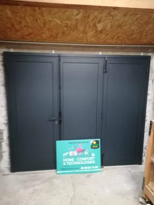 Installation d'une porte de garage à battants en aluminium sécurisé 3 point de fermeture à saint-gely du fesc