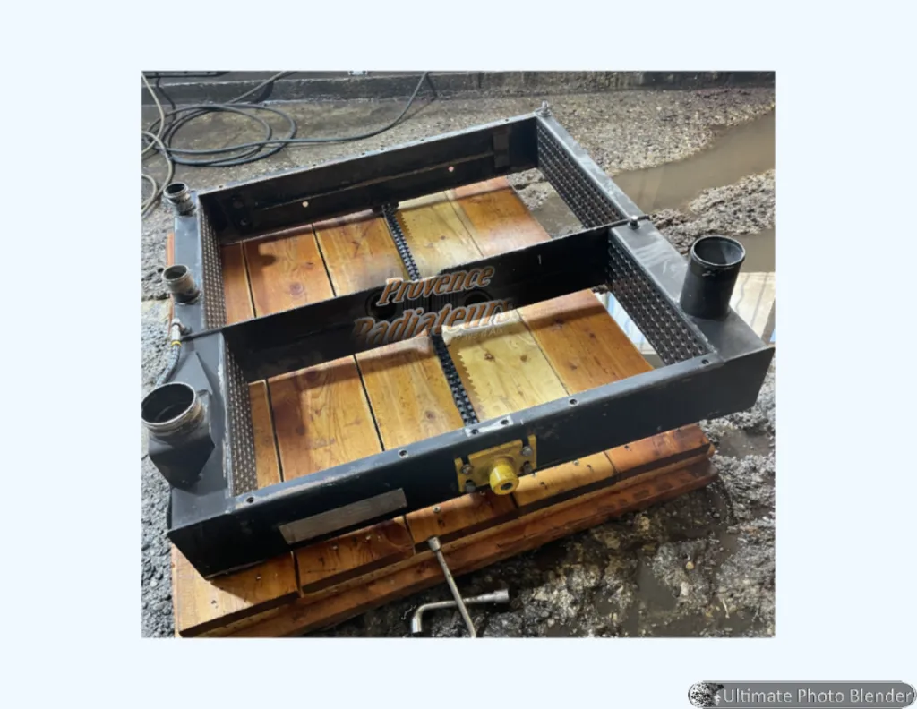 Réparation d'un radiateur de refroidissement d'engin TP par dépose totale des tubes à Aix-en-Provence.