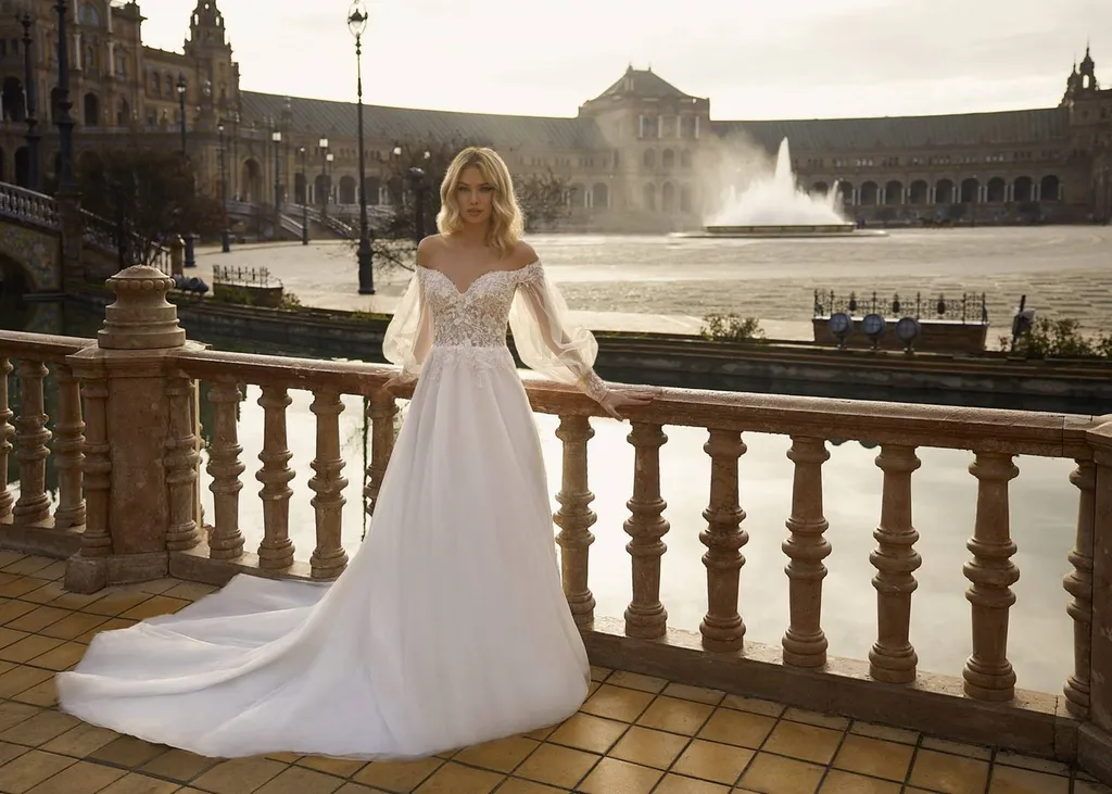 robe de mariée princesse avec longue traine et manche bateau robe avec manche longue modulable robe de créateur Marseille
