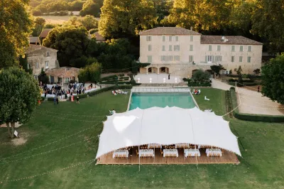 Bohemian and Chic Wedding with white nomad marquee and swimming pool in a Castle in Luberon Provence