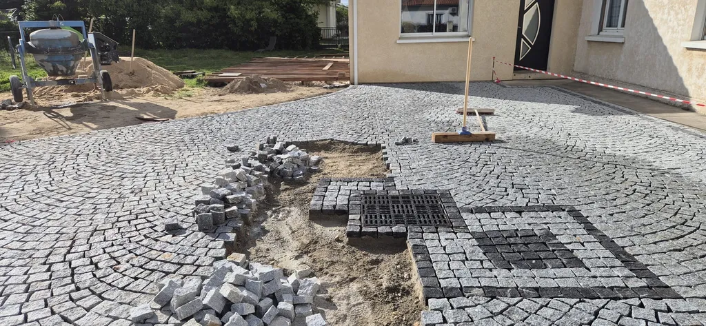 Fourniture et pose de pavés en granit gris pour une allée carrossable près de Saint André de Cubzac