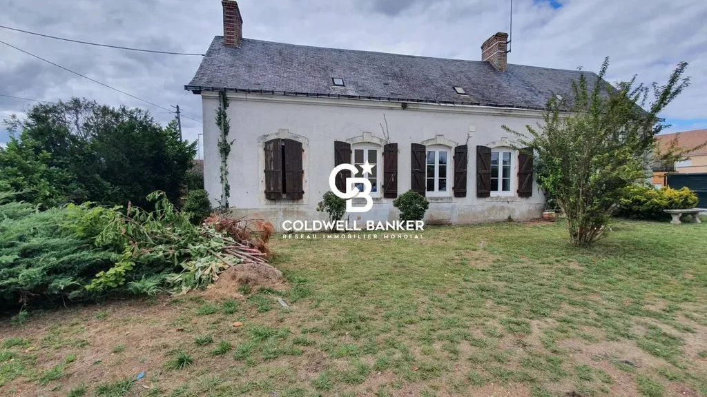 Charmante longère de plain-pied avec potentiel de rénovation au centre d'Arnage, idéale pour construction neuve