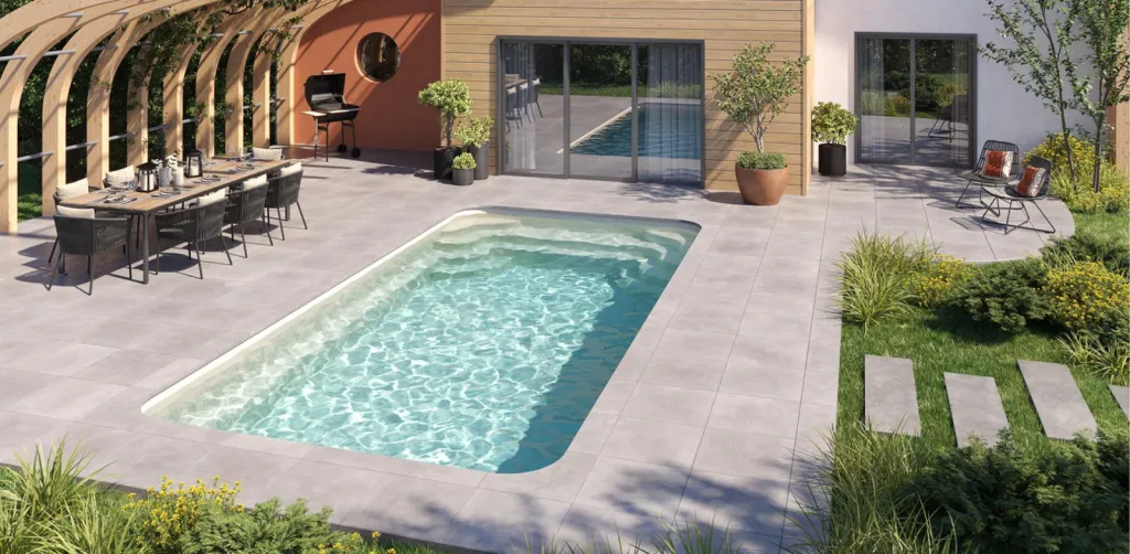 Piscine coque aux lignes douces avec fond plat et angles arrondis – Modèle Dolce installé dans les Landes et la Gironde