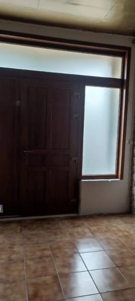 Pose d'une porte d'entrée en PVC imitation bois, haute performance avec châssis vitrés Premium Ouvertures à le Vaudioux dans le Jura