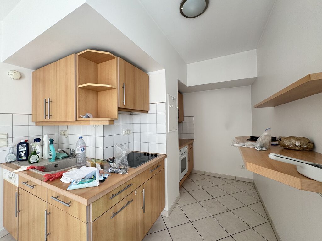 cuisine ouverte sur le séjour proche place du marché Helix immobilier 